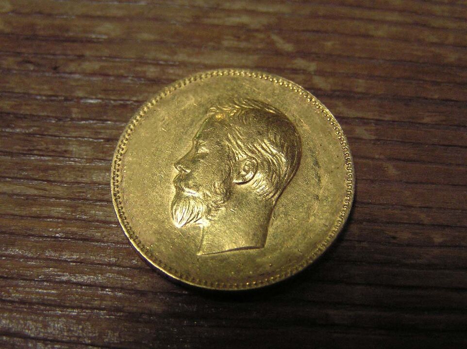 Moneta d'oro per il benessere finanziario